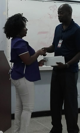 Janelle wins!! Nurse Janelle Jacobs received her raffle prize of Lunch for two at Hyatt Regency Hotel from Assistant Treasurer Sherman Braithwaithe .  Miss Jacobs qualified to enter this Northern Branch promotion, by joining TTRNA during the recent membership drive at POSGH. Northern Branch. Congratulations Janelle, And Welcome on board!